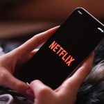 Girl, smartphone, netflix — Experience Premium National TV Sports Streaming in Ultra HD on Jeonguk TV